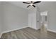 Light-filled bedroom boasts a ceiling fan and convenient closet for ample storage space at 96 Saint Johns Wood Ave, Henderson, NV 89002
