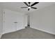 Bedroom featuring carpet, ceiling fan, and walk in closet at 96 Saint Johns Wood Ave, Henderson, NV 89002