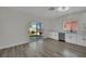 Open kitchen with white cabinets, stainless steel appliances and sliding doors to backyard at 96 Saint Johns Wood Ave, Henderson, NV 89002