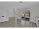 Bright room with a sliding glass door that looks out to the green backyard at 96 Saint Johns Wood Ave, Henderson, NV 89002