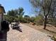 Backyard featuring a brick paver patio, mature landscaping, and a peaceful outdoor seating area at , Las Vegas, NV 89179