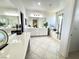 Bright bathroom features tiled floors, dual sinks, and a large soaking tub at , Las Vegas, NV 89179