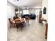 Open dining area with tile floors, chandelier, and furniture; adjacent to the living room at , Las Vegas, NV 89179