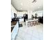 Spacious kitchen with granite countertops, black appliances, an island with bar stools, and ample storage at , Las Vegas, NV 89179