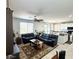 Open concept living room with comfortable seating, ceiling fan, and an adjacent kitchen area at , Las Vegas, NV 89179