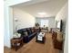Comfortable living room with a plush sofa, carpet flooring, and ample natural light from the window at , Las Vegas, NV 89179