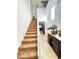 Carpeted staircase leading to the second floor with natural light and elegant decor at , Las Vegas, NV 89179