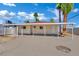 Back of the house featuring a covered patio with support beams and a large, concrete backyard at 101 N 19Th St, Las Vegas, NV 89101