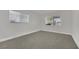 Bright carpeted bedroom with two windows providing plenty of natural light at 101 N 19Th St, Las Vegas, NV 89101