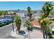 Charming single-story home featuring a red roof, a gravel yard, palm trees, and Las Vegas skyline views at 101 N 19Th St, Las Vegas, NV 89101