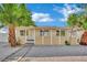 Well-maintained single-story home with a stone walkway, palms, and neutral exterior at 101 N 19Th St, Las Vegas, NV 89101