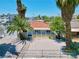 Home's front yard featuring desert landscaping, palm trees, and ample space for parking at 101 N 19Th St, Las Vegas, NV 89101