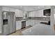 Modern kitchen with stainless steel appliances, white cabinetry, and wood-look flooring at 101 N 19Th St, Las Vegas, NV 89101