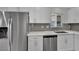 Updated kitchen features modern stainless steel appliances and bright white cabinets at 101 N 19Th St, Las Vegas, NV 89101