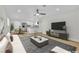 Bright, open-concept living room features a ceiling fan, recessed lighting, and flows into a modern kitchen at 101 N 19Th St, Las Vegas, NV 89101