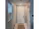Inviting entryway with a neutral color palette, a coat closet, and a window that provides natural light at 10163 Kings Amethyst St, Las Vegas, NV 89141