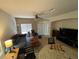 Cozy living room with neutral colors and plenty of seating at 1169 Via Piazza, Henderson, NV 89052