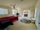 Spacious main bedroom with ceiling fan and adjoining bathroom at 1169 Via Piazza, Henderson, NV 89052