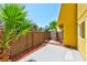 Private backyard features a concrete patio, lush plants and a wood fence at 1480 Hialeah Dr # B, Las Vegas, NV 89119