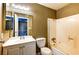Standard bathroom featuring a shower-tub combo, white vanity, framed mirror, and access to upstairs hallway at 1480 Hialeah Dr # B, Las Vegas, NV 89119