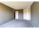 Bedroom includes carpet and a built-in mirrored closet with shelving next to an entrance to the upstairs hallway at 1480 Hialeah Dr # B, Las Vegas, NV 89119