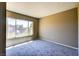 Bright bedroom with a large window allowing plenty of natural light into the carpeted room at 1480 Hialeah Dr # B, Las Vegas, NV 89119
