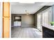 The large dining room includes laundry hook-ups, backyard access, a backyard view, tile floor and utility cabinets at 1480 Hialeah Dr # B, Las Vegas, NV 89119