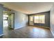The living room with tile flooring and a door to the backyard, provides plenty of natural light at 1480 Hialeah Dr # B, Las Vegas, NV 89119