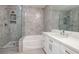 Sleek bathroom featuring a soaking tub, separate shower, and modern vanity with quartz countertops at 1705 King James St # 203, Las Vegas, NV 89144