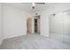 Bright bedroom featuring plush carpet flooring, ceiling fan, large mirrored closet and private ensuite bathroom at 1705 King James St # 203, Las Vegas, NV 89144