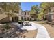 Community courtyard with seating, barbecue and lush, mature landscaping at 1705 King James St # 203, Las Vegas, NV 89144