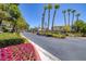 The 'Carlisle' community entrance features mature trees and manicured landscaping at 1705 King James St # 203, Las Vegas, NV 89144