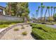 The 'Carlisle' community entrance features lush landscaping and mature trees at 1705 King James St # 203, Las Vegas, NV 89144