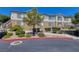 Apartment building with well-maintained landscaping and convenient parking at 1705 King James St # 203, Las Vegas, NV 89144