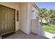Inviting front door of the home, complemented by a well-manicured lawn and greenery at 1705 King James St # 203, Las Vegas, NV 89144