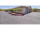 Attached garages with well-maintained landscaping and parking areas at 1705 King James St # 203, Las Vegas, NV 89144