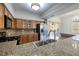 Granite counters and stainless steel appliances accent this open-concept kitchen design at 1705 King James St # 203, Las Vegas, NV 89144