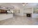 Bright open living room with tile floors, fireplace, and sliding door to the patio at 1705 King James St # 203, Las Vegas, NV 89144