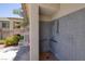 A private outdoor shower offers convenience and refreshment in this home, with gray tile and modern fixtures at 1705 King James St # 203, Las Vegas, NV 89144