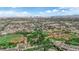 Stunning aerial view showcasing residential neighborhoods, baseball fields and the distant city skyline at 1919 Belcastro St, Las Vegas, NV 89117