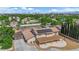 An aerial view of the property with solar panels, covered patio, landscaping, and city views at 1919 Belcastro St, Las Vegas, NV 89117