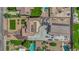 Aerial view of a sprawling property with a large garage, a well-manicured lawn, and ample parking space at 1919 Belcastro St, Las Vegas, NV 89117