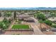 Expansive property featuring a large home, extended driveway, manicured lawns and desert landscaping at 1919 Belcastro St, Las Vegas, NV 89117