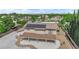 An aerial view displaying a home, solar panels, a covered patio, plus mature landscaping at 1919 Belcastro St, Las Vegas, NV 89117