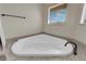 Bathroom features a corner jacuzzi tub with jets, perfect for relaxation and comfort at 1919 Belcastro St, Las Vegas, NV 89117