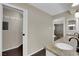 Bathroom with granite countertops, double sinks, and views into the walk-in closet and shower at 1919 Belcastro St, Las Vegas, NV 89117