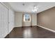 Bedroom features a dark accent wall, wood floors, and a large closet at 1919 Belcastro St, Las Vegas, NV 89117