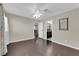 Bedroom showcasing hardwood floors and neutral color palette with easy access to ensuite bathroom at 1919 Belcastro St, Las Vegas, NV 89117