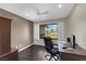 Office area with dark wood floors and a window offering natural light and views at 1919 Belcastro St, Las Vegas, NV 89117