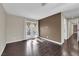 Bright bedroom with hardwood floors and French doors opening to a balcony or patio at 1919 Belcastro St, Las Vegas, NV 89117